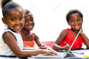 35973281-Portrait-of-threesome-African-kids-with-laptop-at-table-Isolated-on-white-background--Stock-Photo